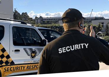 Security vehicle patrolling business premises at night